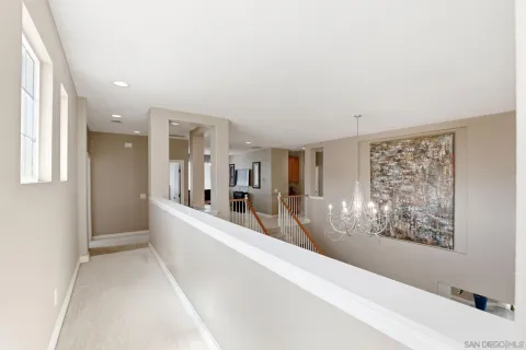 a living room with fireplace furniture and a chandelier
