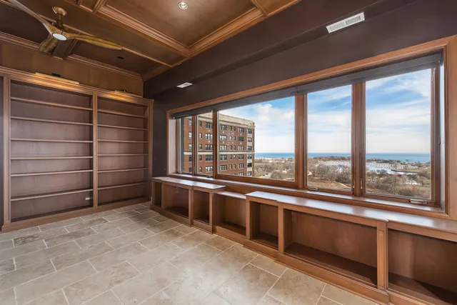 a view of an empty room with a window