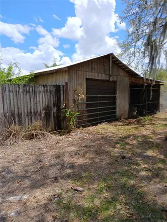 a view of backyard with green space