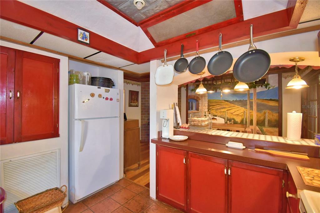 760 McClellan Road Frostproof, FL 33843 - Photo 24 of 72 a kitchen with stainless steel appliances granite countertop a refrigerator and a stove