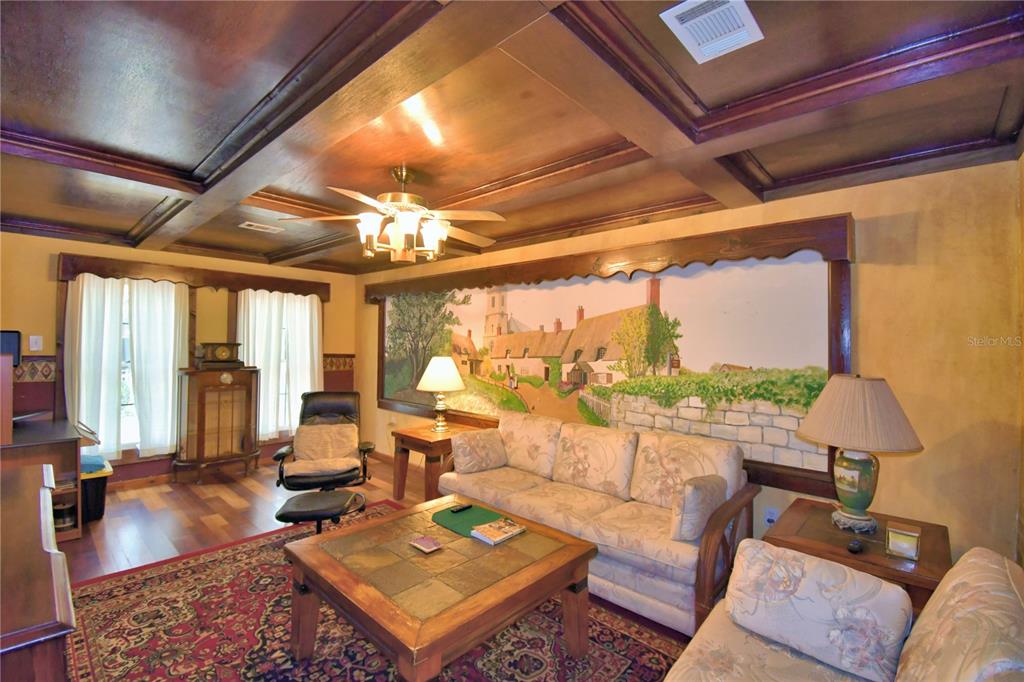 760 McClellan Road Frostproof, FL 33843 - Photo 6 of 72 a living room with furniture and a large window