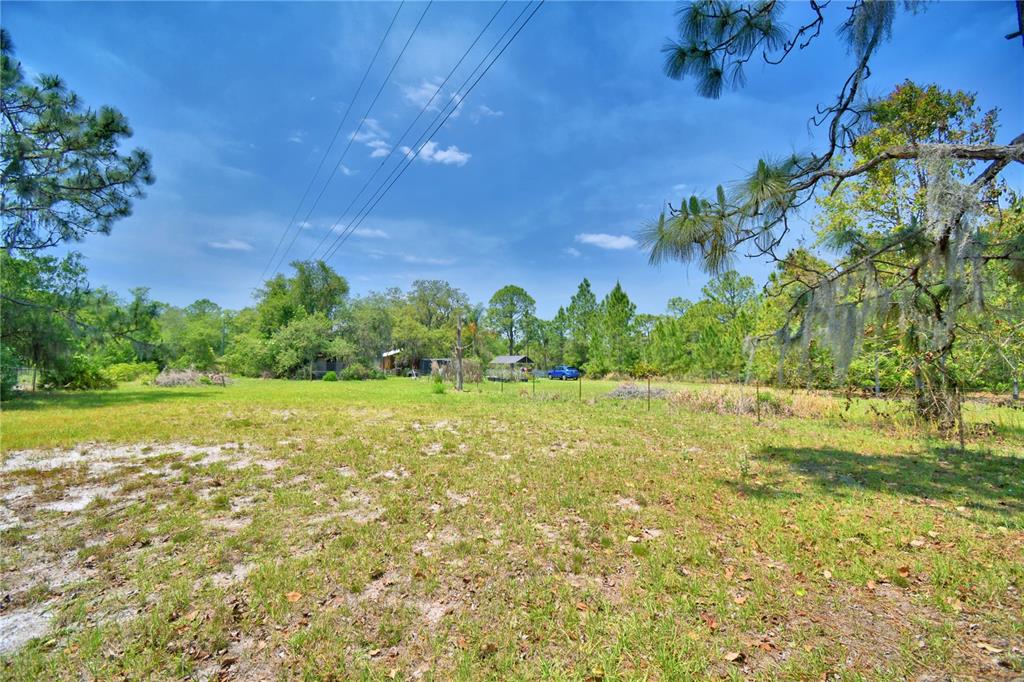 760 McClellan Road Frostproof, FL 33843 - Photo 66 of 72 a view of a lake with a yard
