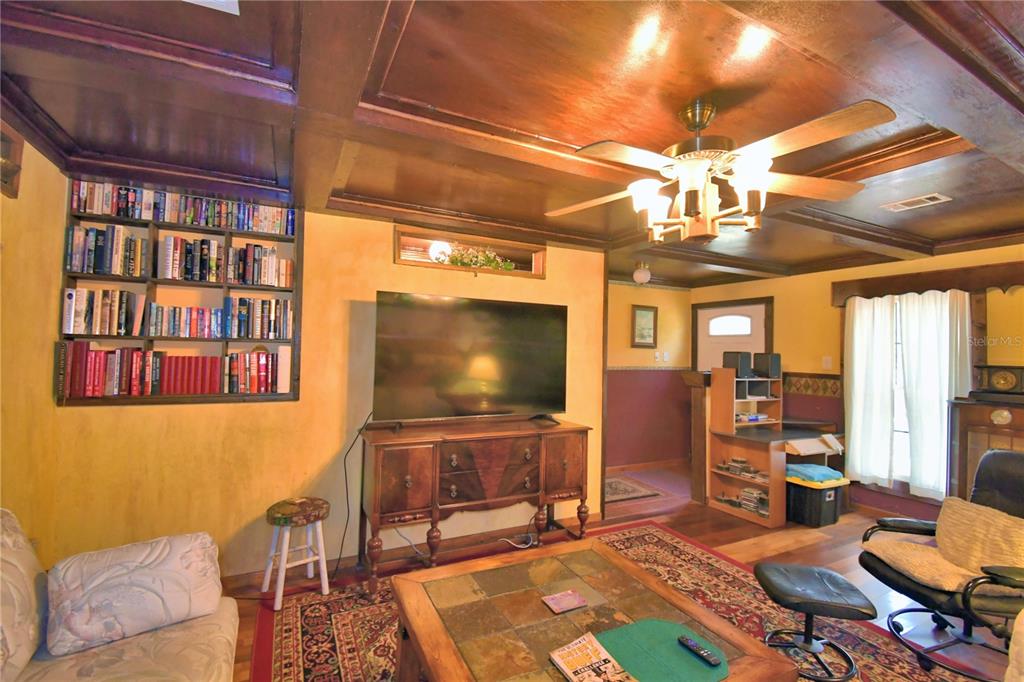 760 McClellan Road Frostproof, FL 33843 - Photo 7 of 72 a living room with furniture and a flat screen tv