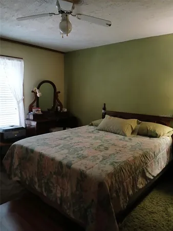 a room with a table chairs and a kitchen view