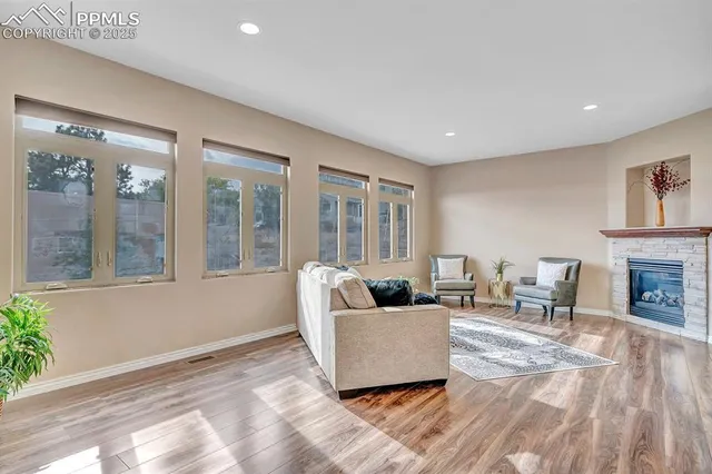 a living room with furniture and a fireplace