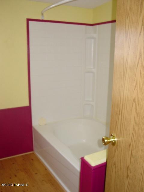 5201 North Lak A Yucca Road Tucson, AZ 85743 - Photo 12 of 19 a bathroom with a shower and a bath tub