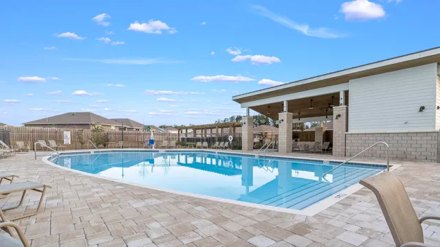 a view of a swimming pool with a patio