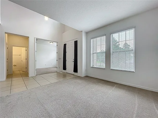 a kitchen with granite countertop cabinets and window