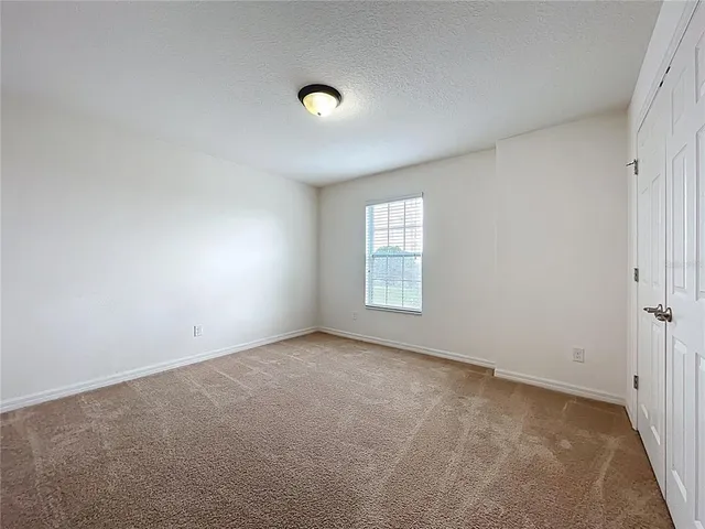 an empty room with a bathroom