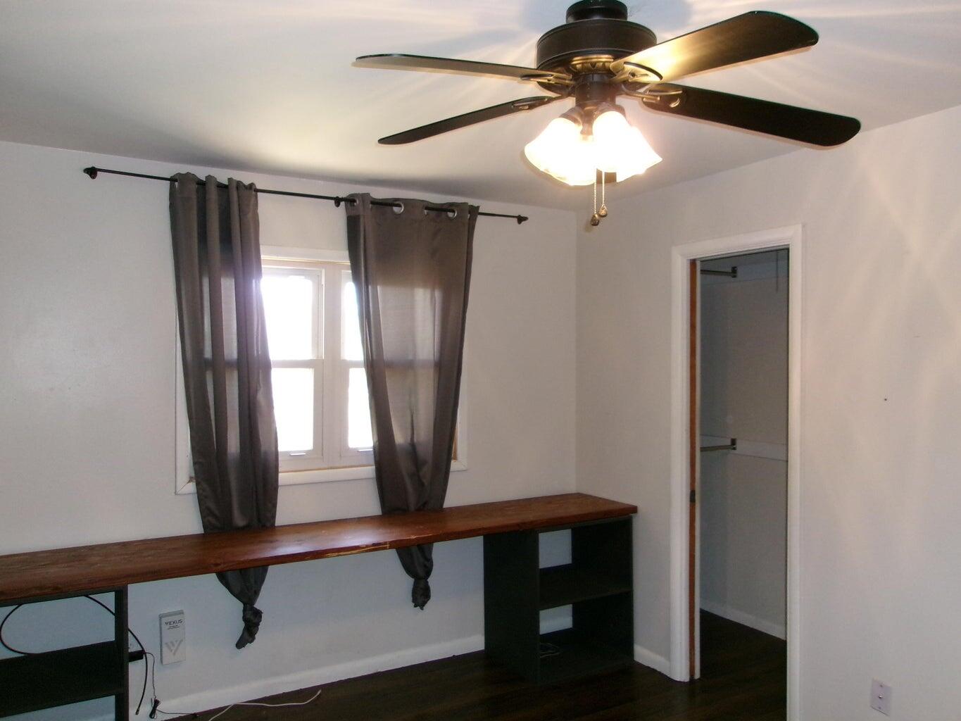 1201 Borger Plainview, TX 79072 - Photo 12 of 22 a view of entryway with a chandelier fan and a window