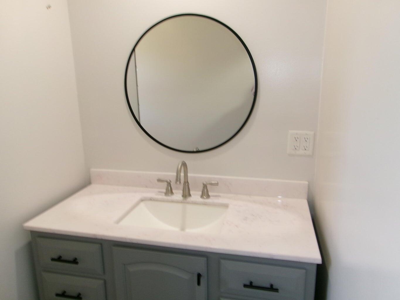 1201 Borger Plainview, TX 79072 - Photo 19 of 22 a bathroom with a sink and a mirror