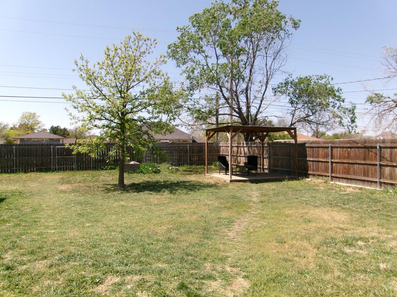 1201 Borger Plainview, TX 79072 - Photo 22 of 22 a view of a garden with a tree