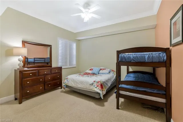 a bedroom with a bed and a dresser in it