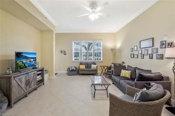 a living room with furniture and a window
