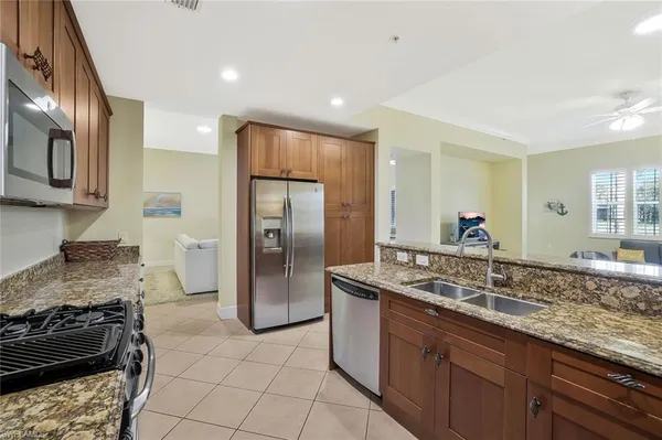 a kitchen with a sink stove and refrigerator