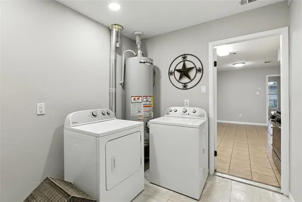 a utility room with dryer and washer