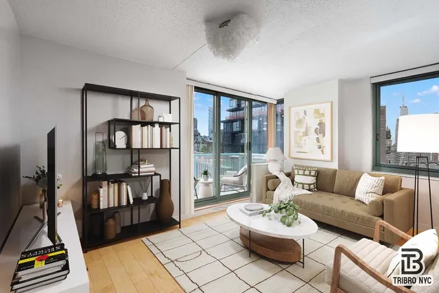 a living room with furniture fireplace and a flat screen tv
