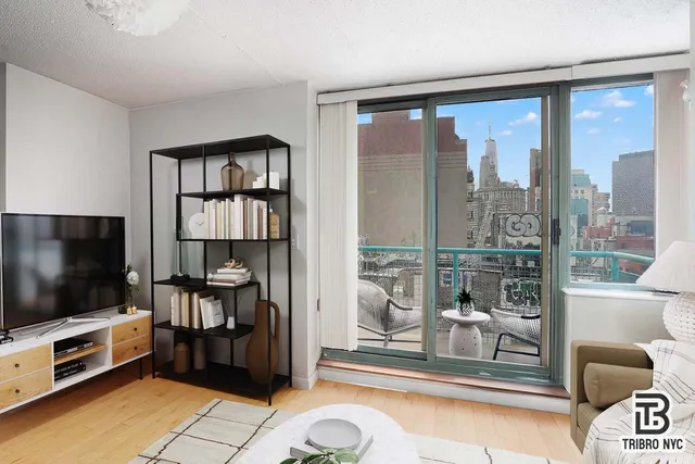 a living room with furniture and a flat screen tv