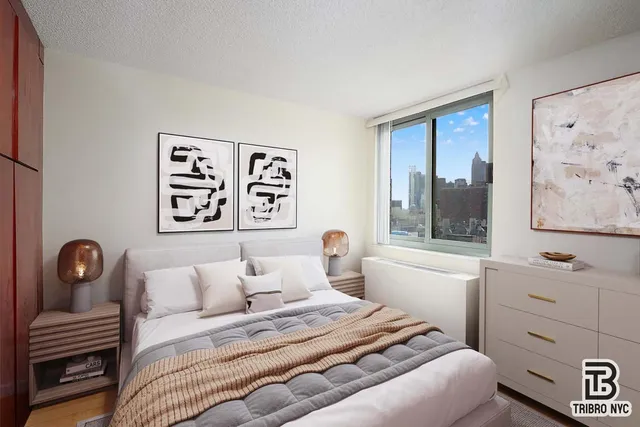 a bedroom with a bed and a window