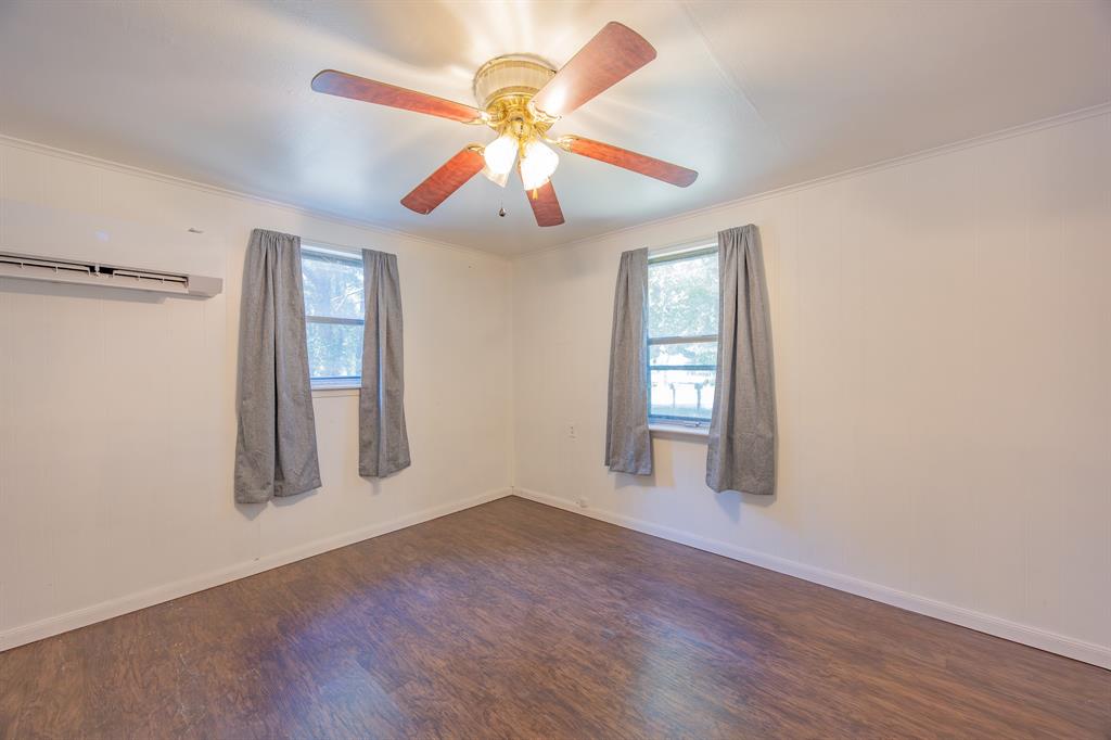 925 Angies Crossing Tool, TX 75143 - Photo 17 of 25 wooden floor in an empty room with a window