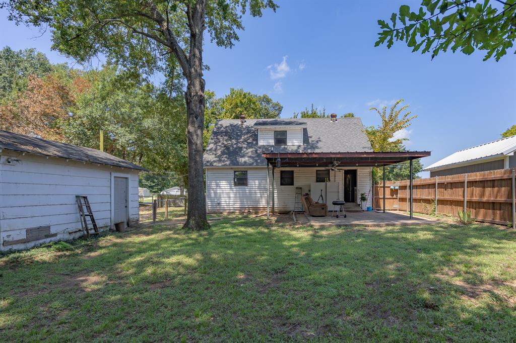 925 Angies Crossing Tool, TX 75143 - Photo 24 of 25 a view of a house with a yard and sitting area