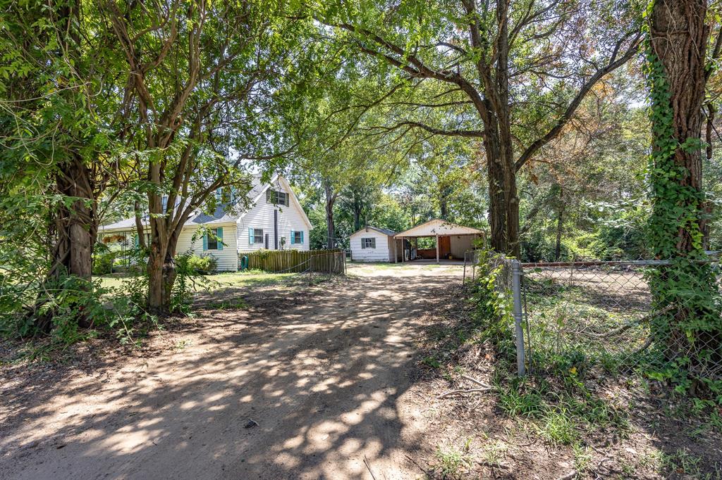 925 Angies Crossing Tool, TX 75143 - Photo 6 of 25 a backyard of a house with trees and outdoor seating