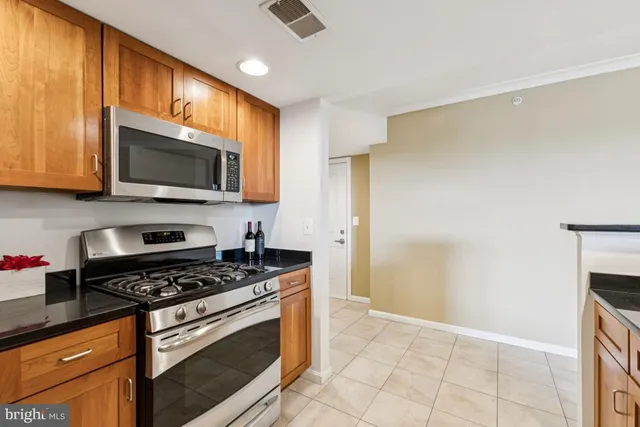 a bedroom with a bed and painting on the wall