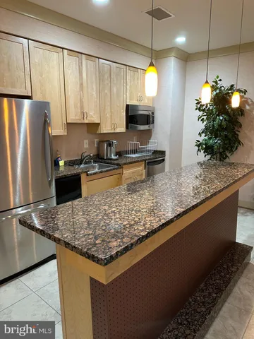 a living room with lots of furniture and a chandelier