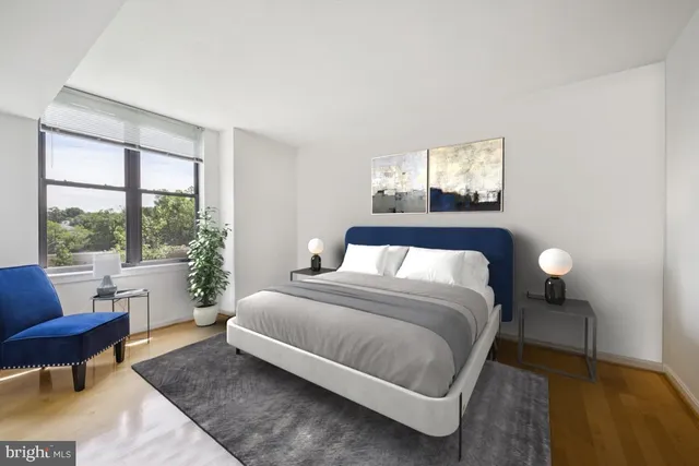 a bedroom with a bed and a couch