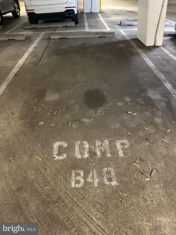 a street sign on a sidewalk next to a road