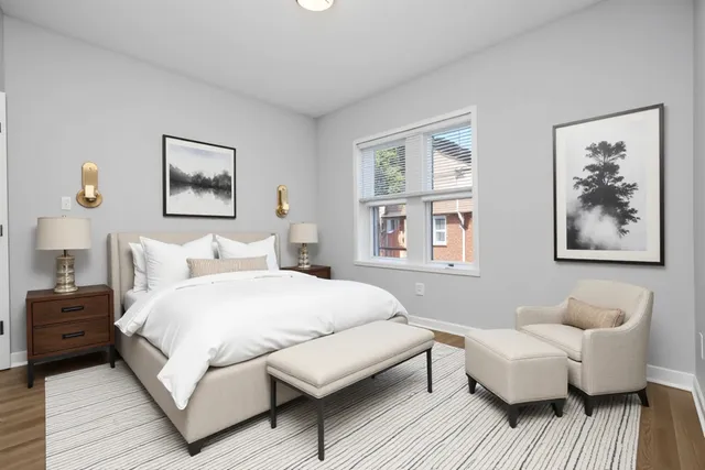 a bedroom with a bed and a couch