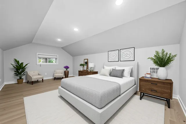 a bedroom with a bed and a couch