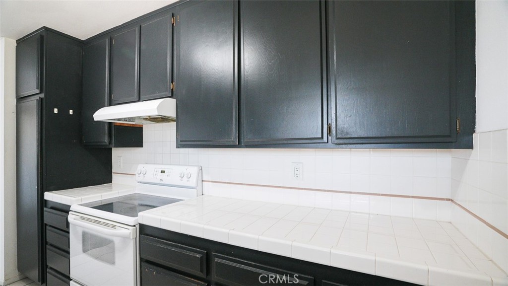 833 Cinnamon Lane, Unit 4 Duarte, CA 91010 - Photo 11 of 34 a bathroom with a sink and a washer dryer