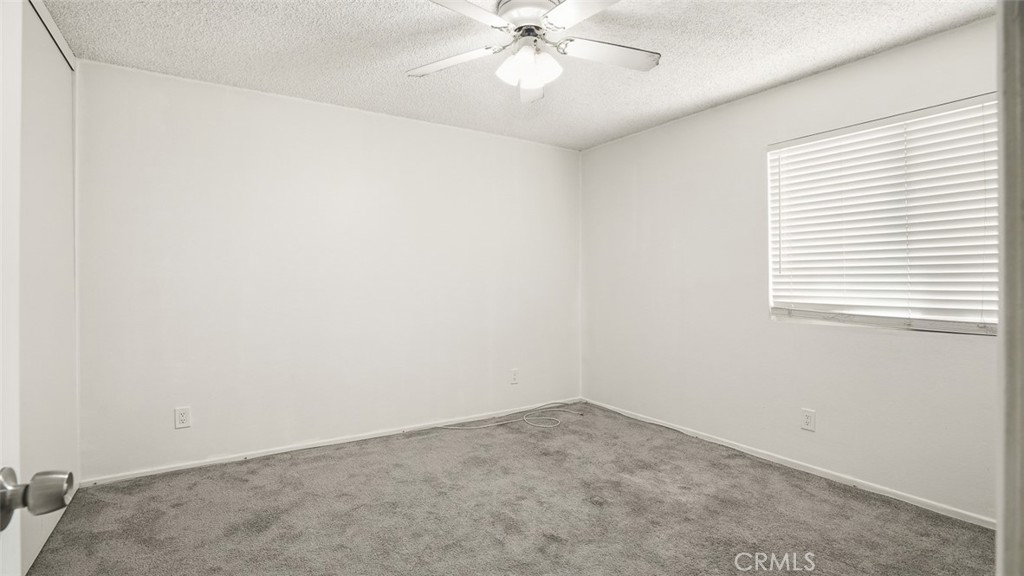 833 Cinnamon Lane, Unit 4 Duarte, CA 91010 - Photo 17 of 34 an empty room with a window and a fan