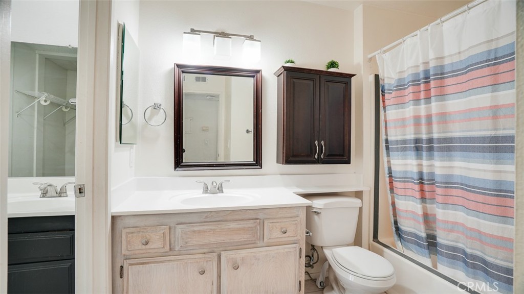 833 Cinnamon Lane, Unit 4 Duarte, CA 91010 - Photo 19 of 34 a bathroom with a sink toilet vanity and shower