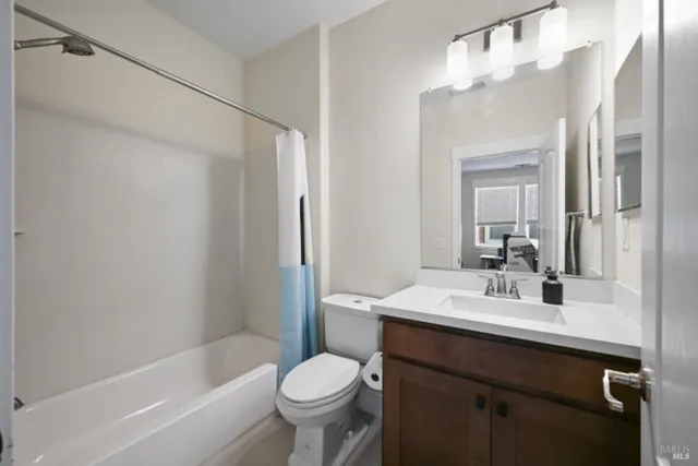 a bathroom with a sink double vanity and a mirror