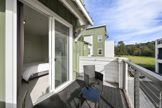 a view of a patio with table and chairs