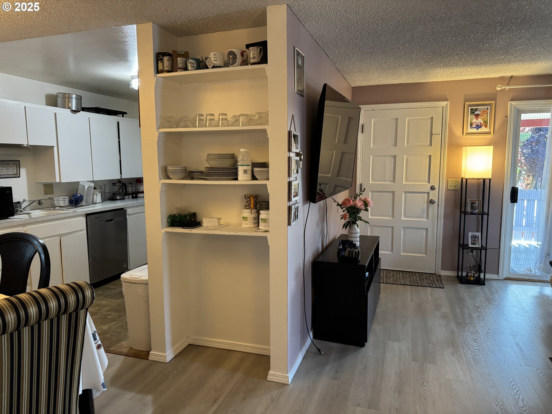 3398 Southwest 125th Avenue Beaverton, OR 97005 - Photo 18 of 25 a view of a kitchen with refrigerator and wooden floor