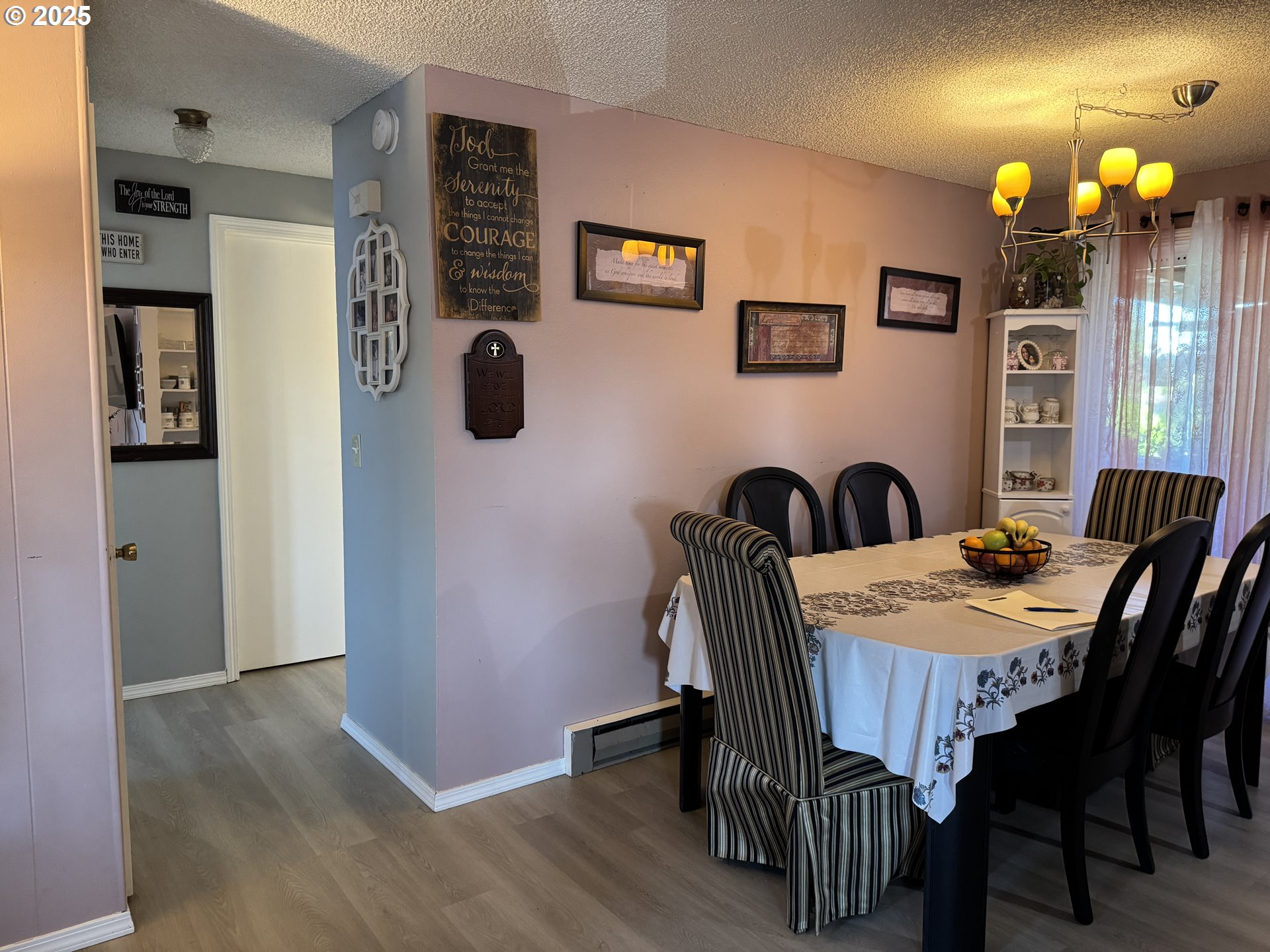 3398 Southwest 125th Avenue Beaverton, OR 97005 - Photo 19 of 25 a view of a dining room with furniture and wooden floor