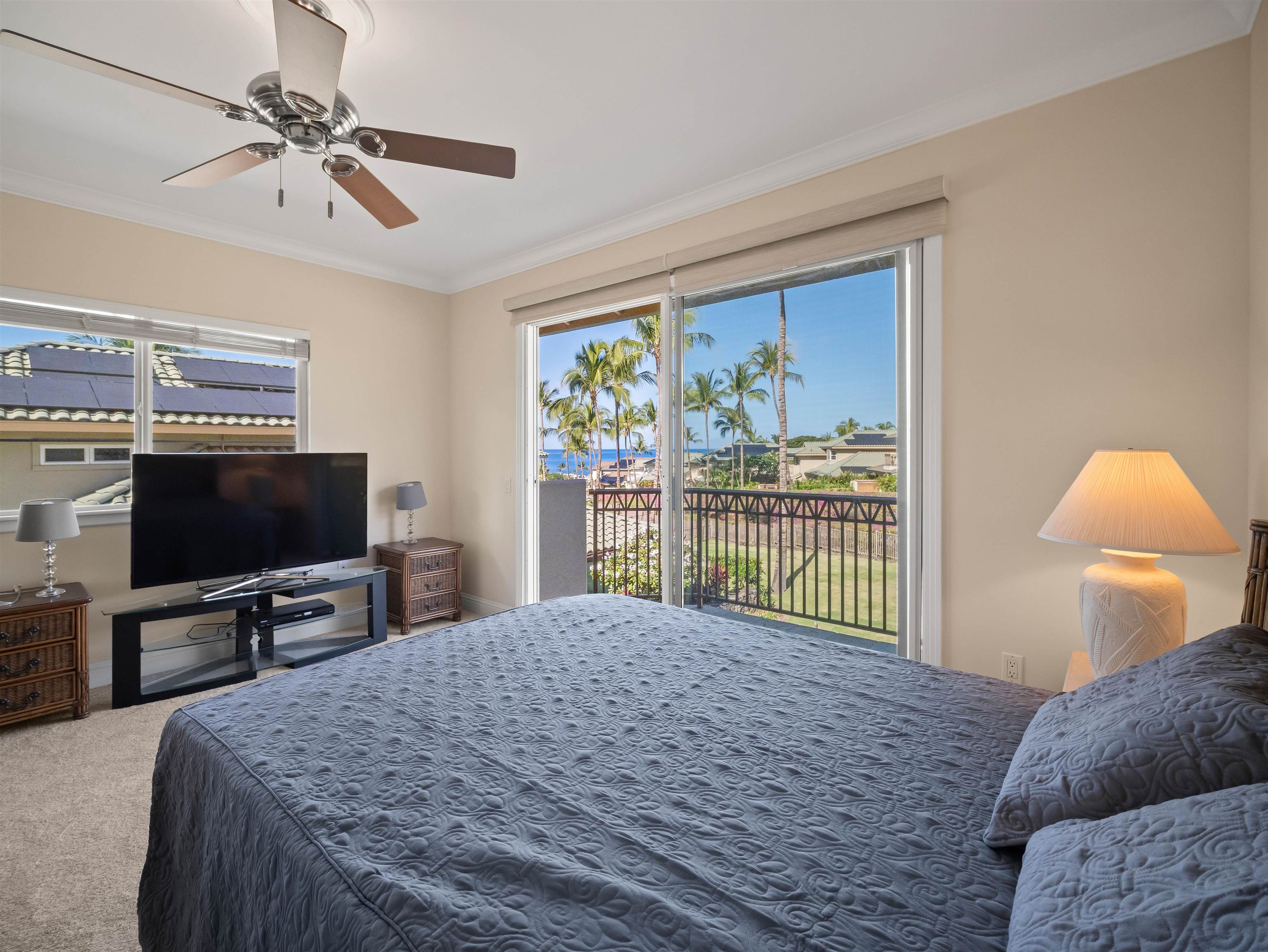 28 Kai La Place, Unit 19A Kihei, HI 96753 - Photo 13 of 49 a bedroom with a bed and a flat screen tv