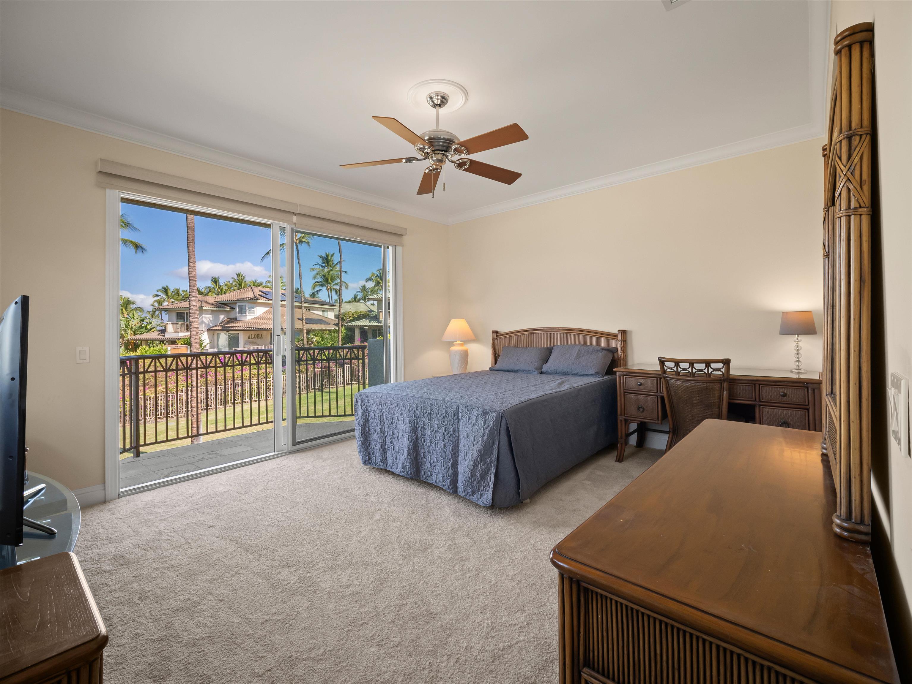 28 Kai La Place, Unit 19A Kihei, HI 96753 - Photo 19 of 49 a spacious bedroom with a bed and a large window