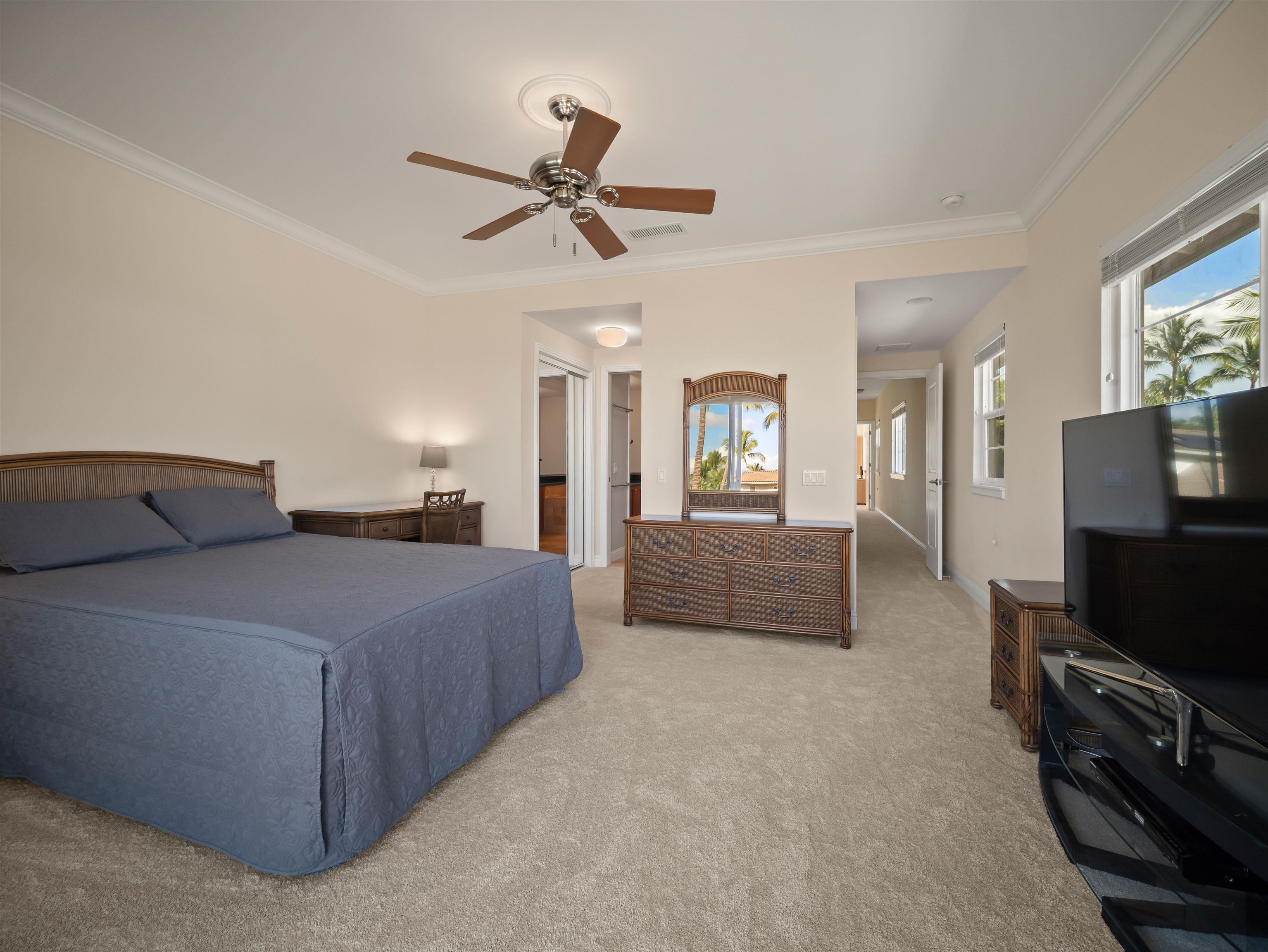 28 Kai La Place, Unit 19A Kihei, HI 96753 - Photo 20 of 49 a bedroom with a bed and a television in it