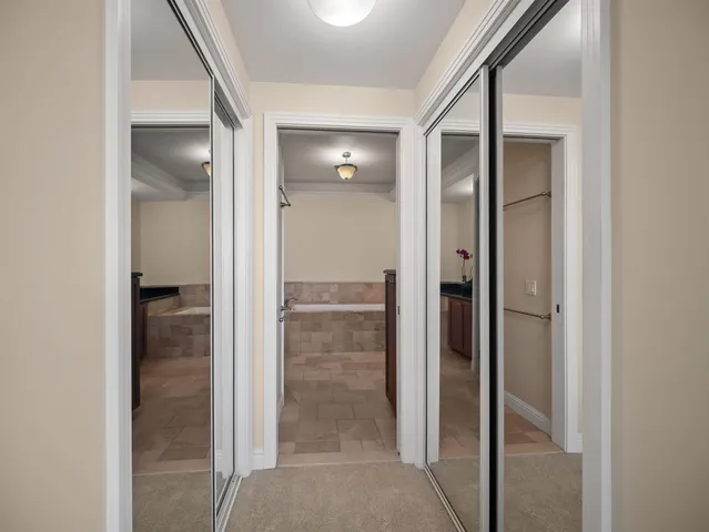 a bathroom with a bathtub sink and mirror
