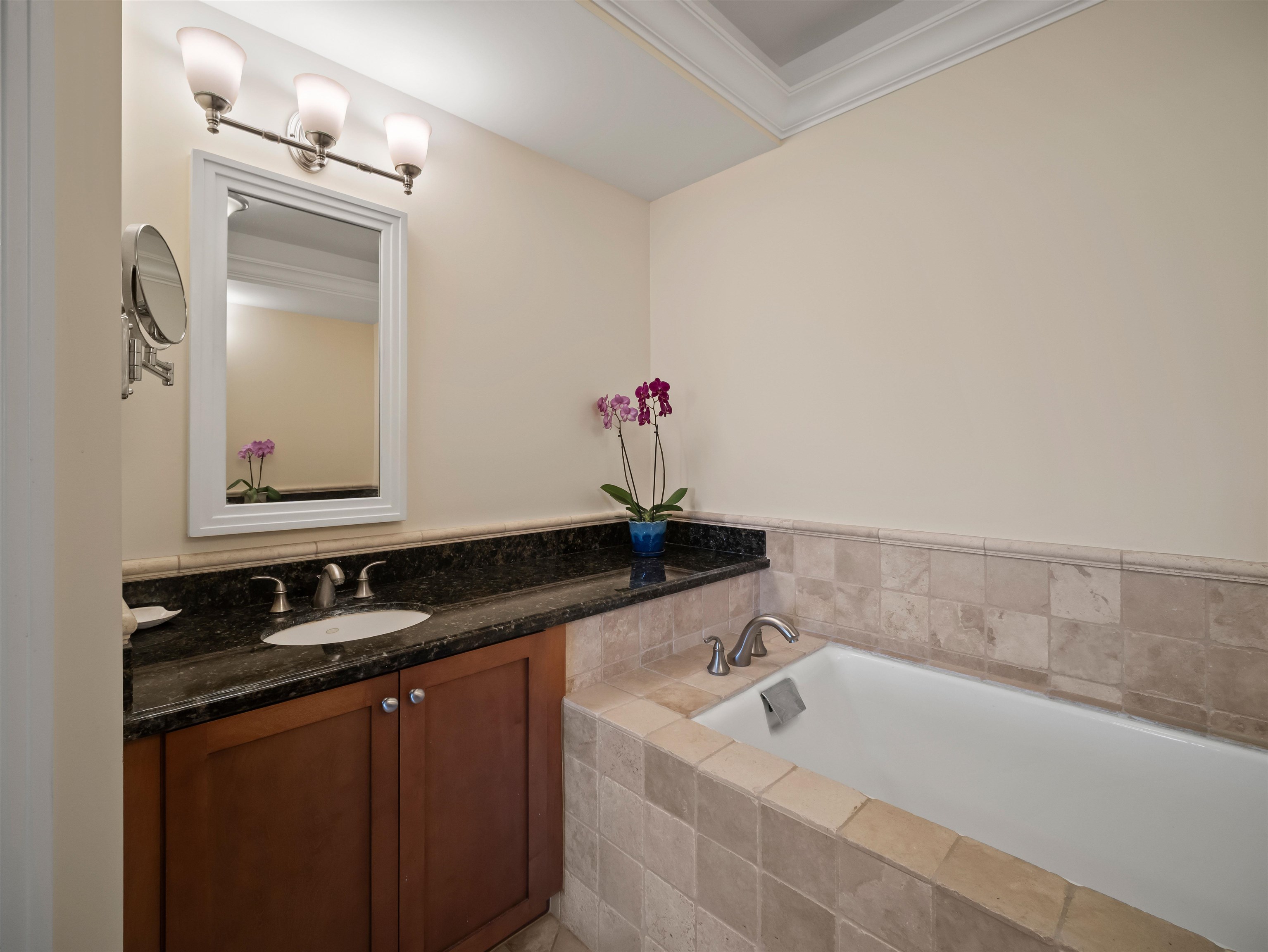 28 Kai La Place, Unit 19A Kihei, HI 96753 - Photo 23 of 49 a bathroom with a sink and a mirror