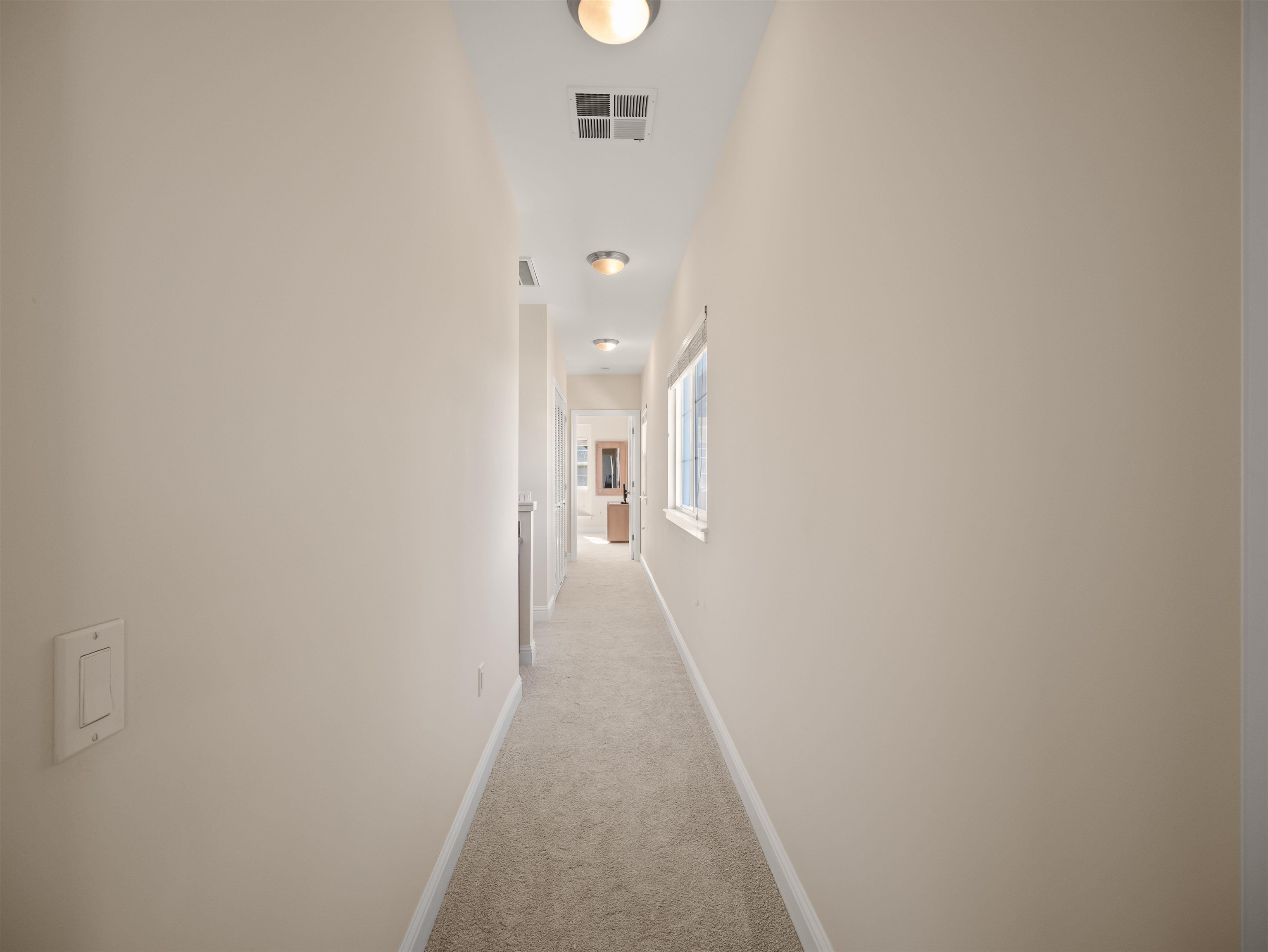 28 Kai La Place, Unit 19A Kihei, HI 96753 - Photo 26 of 49 a view of a hallway with wooden floor