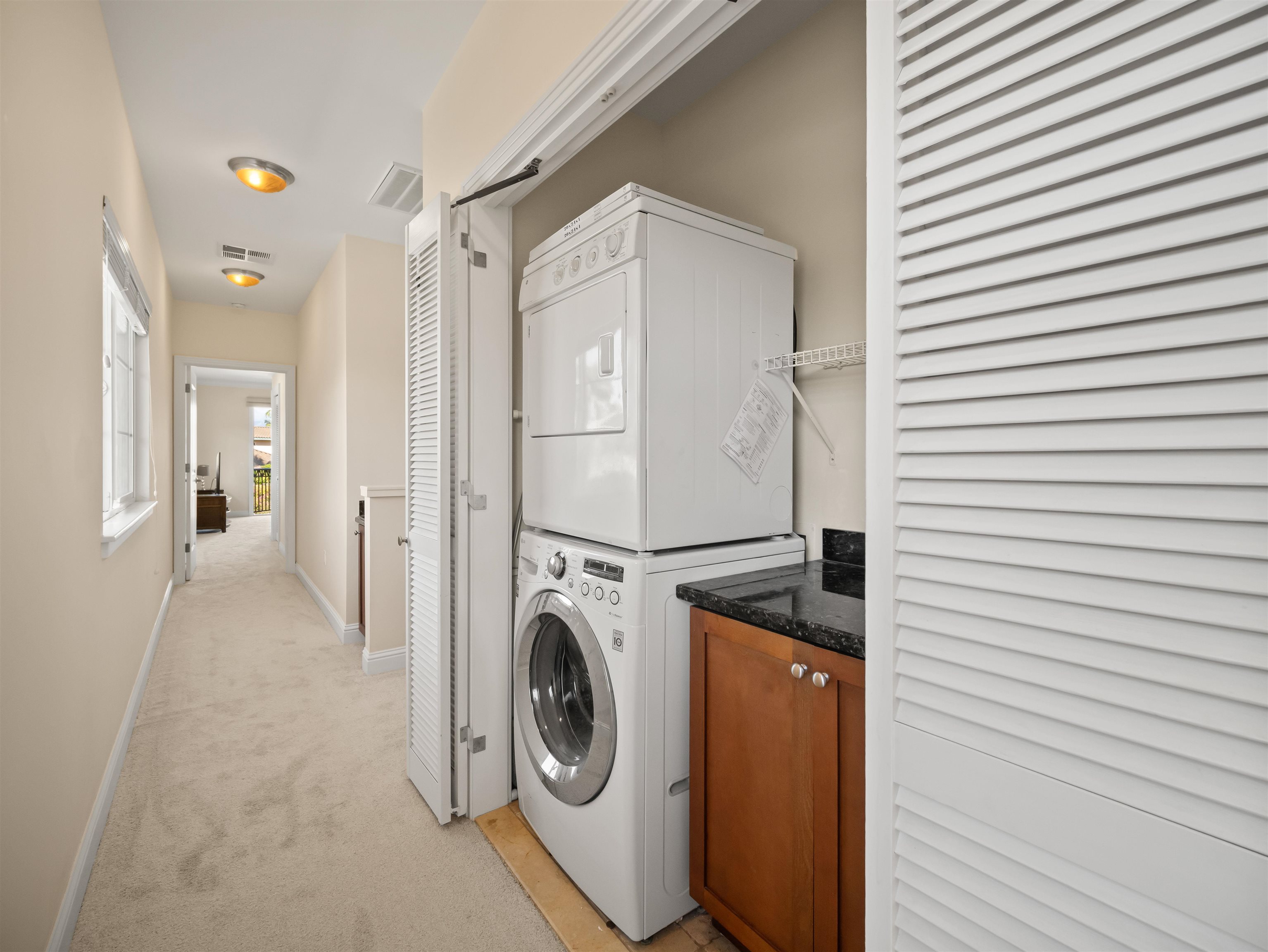28 Kai La Place, Unit 19A Kihei, HI 96753 - Photo 32 of 49 a utility room with dryer and washer