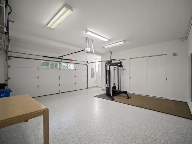 a front view of a house with a yard and a garage