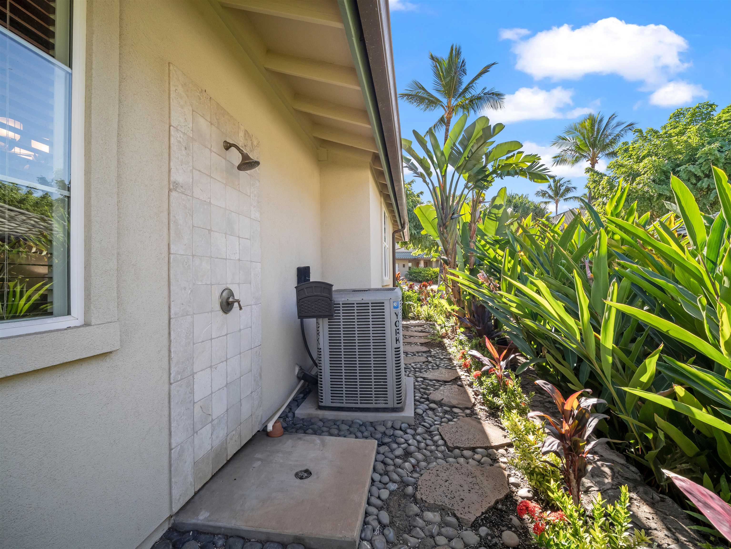 28 Kai La Place, Unit 19A Kihei, HI 96753 - Photo 42 of 49 a view of a door and a plant in a backyard