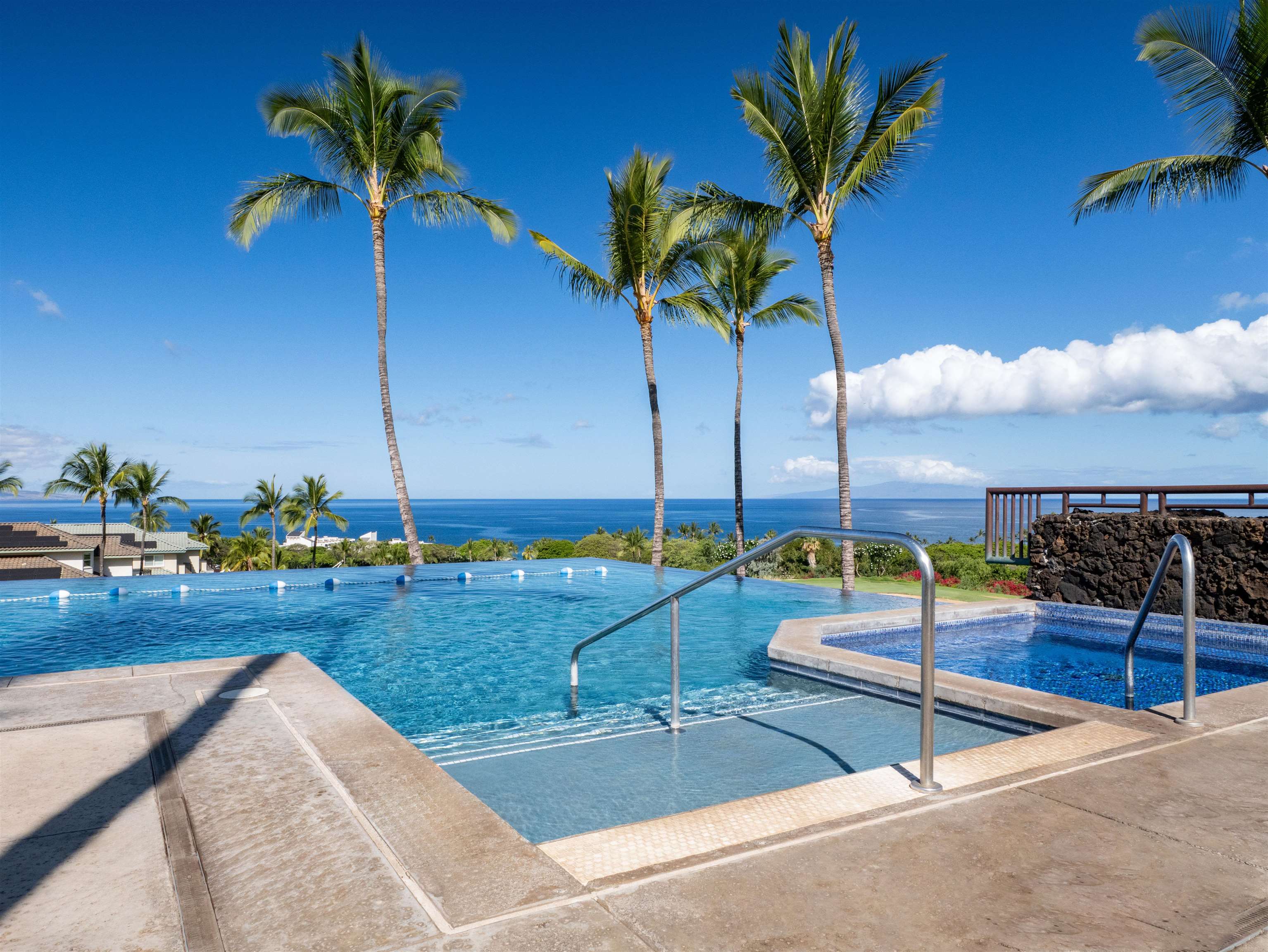 28 Kai La Place, Unit 19A Kihei, HI 96753 - Photo 48 of 49 a view of a swimming pool with a table and chairs