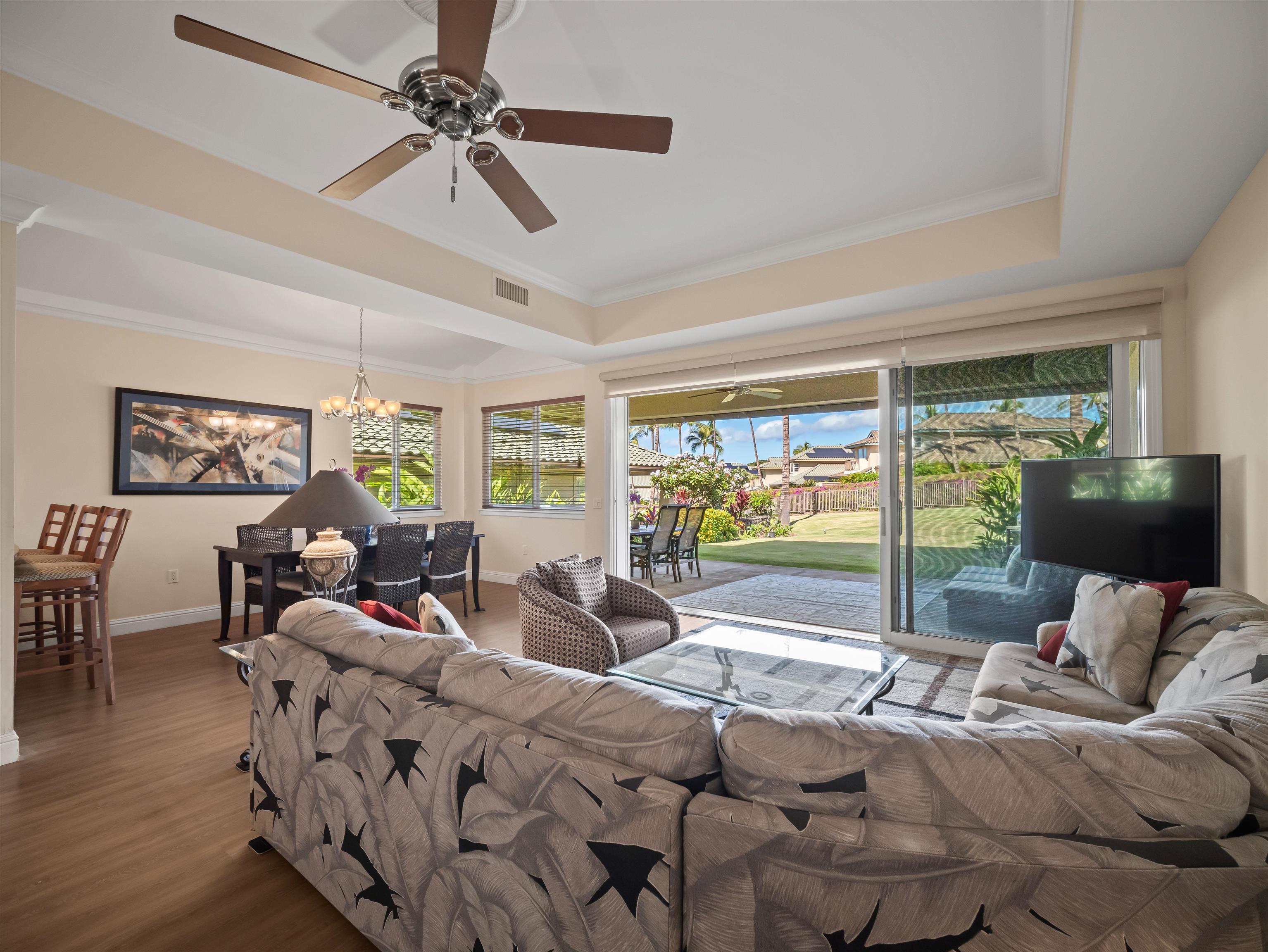 28 Kai La Place, Unit 19A Kihei, HI 96753 - Photo 7 of 49 a living room with furniture and a floor to ceiling window